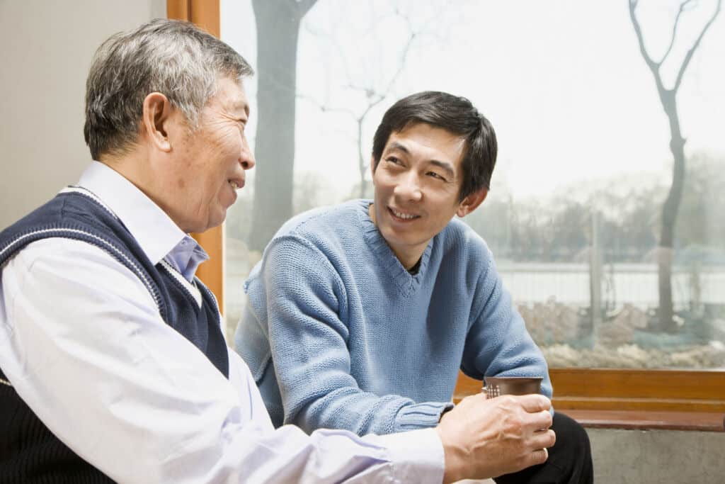 Image of son discussing care support with father